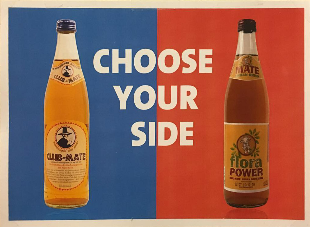 An image of a bottle Club Mate, a bottle Flora Power Mate and the text: Choose your side!